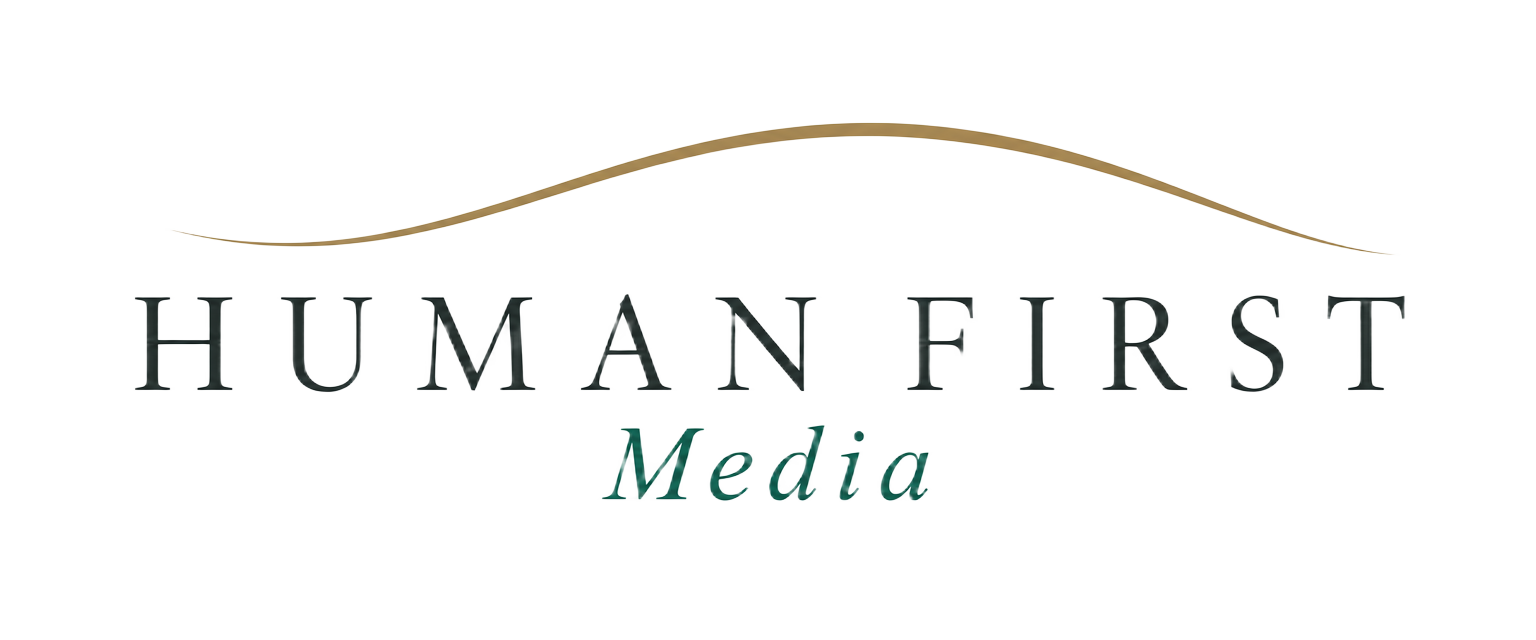 Human First Media logo with a brass arc above the name