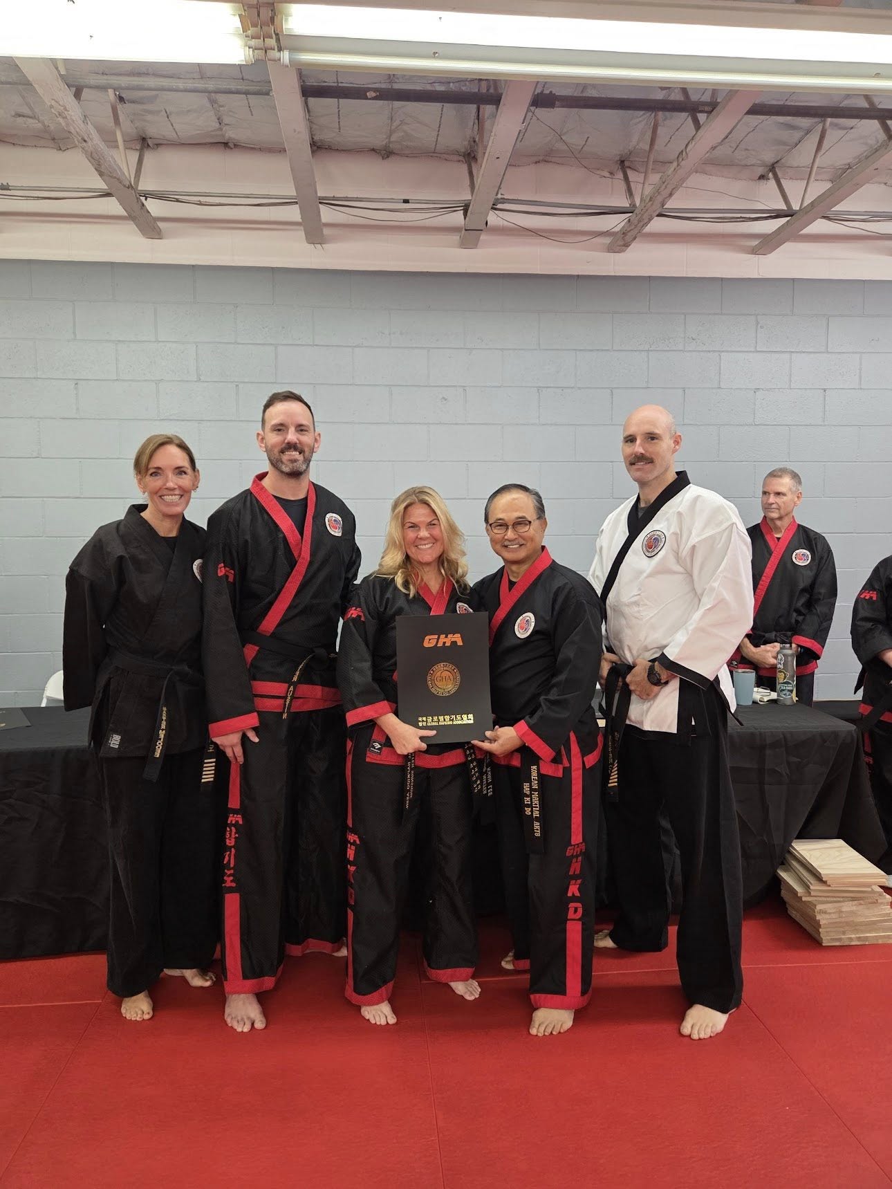 Meredith Medland with Hapkido masters receiving certification
